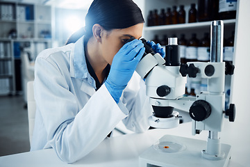 Image showing Woman, scientist and microscope, study and analysis, check DNA sample and science experiment in laboratory. Female doctor analyze data, scientific innovation and medical research with knowledge