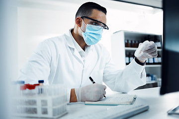 Image showing Laboratory, medical research and scientist writing notes while doing an analysis on virus data. Write, face mask and male science researcher working on scientific project at pharmaceutical lab.