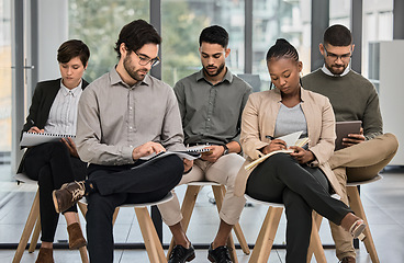 Image showing Meeting, listening or business people writing notes in presentation for education or coaching in company. Mentorship, learning or team of employees taking note of group training in notebook in office