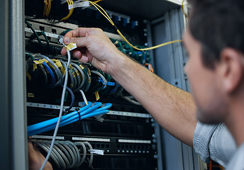 Image showing Server room, technician and hands of man with cable for programming, cybersecurity or maintenance. IT person in datacenter for network connection, software or system upgrade for internet or hardware