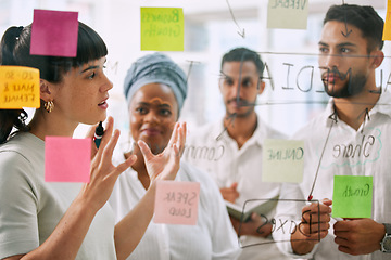 Image showing Teamwork, planning and business people on glass for brainstorming, workflow or meeting of marketing goals. Diversity staff, woman and man in collaboration of ideas, solution or project of sticky note