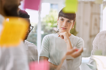 Image showing Thinking, planning and business woman for teamwork, brainstorming and project workflow or management goals. Team or people with group ideas, collaboration and solution on glass board or sticky notes