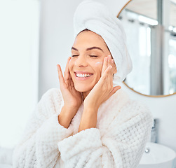 Image showing Skincare, smile and woman with face cream in a bathroom for wellness, dermatology and treatment in her home. Facial, lotion and happy female person with sunscreen, cosmetic and collagen beauty cream