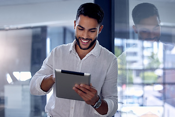 Image showing Tablet, night and research with a business man, happy while working alone in his office after hours. Technology, internet and smile with a male employee doing an online search for information or data