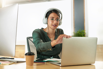 Image showing Virtual meeting, business woman and laptop with video call with headphones and pc. Worker, working and female employee with webinar at a company with computer and digital communication at office