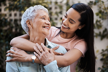 Image showing Happy, hug and loving of a mother and woman in a garden on mothers day with care and gratitude together. Smile, family and an adult daughter hugging a senior mom in a backyard or park for happiness