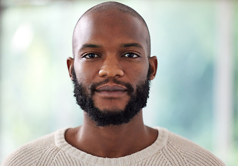 Image showing Face, serious and black man at creative business, startup and career mindset, confident and casual on blurred background. Portrait or headshot of a young African person, worker or entrepreneur in USA