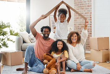 Image showing Black family, floor and cardboard roof in new house for portrait, living room or games with laugh, bond or love. Father, mother and daughter for play, relax or box for sign of security in family home