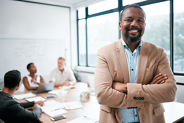 Image showing Business, black man and smile in portrait with arms crossed, leadership and meeting with group for corporate project. Team leader, management and confidence with male person in conference room