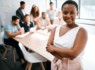 Image showing Black woman in business, smile in portrait and arms crossed, leadership and meeting with company group. Team leader, manager and confidence with female person in conference room and professional