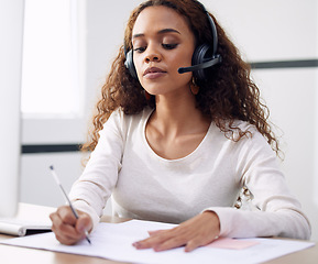 Image showing Call center, serious woman and writing notes for support, customer service and CRM consulting in office. Focused female agent, consultant and documents for telemarketing, administration and web sales