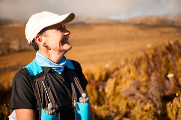 Image showing Happy, hiking and thinking with old woman in nature for wellness, fitness and retirement. Smile freedom and travel with senior hiker trekking in outdoors for environment, adventure and summer