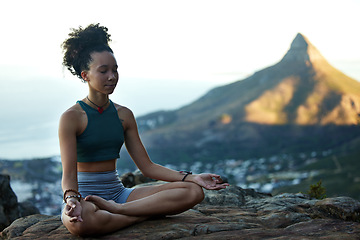 Image showing Woman, mediation and yoga on a mountain with wellness in cape town for fitness and health. Female hiker, calm and meditating on a cliff in the outdoor with nature cityscape for healthy body.