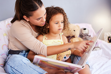 Image showing Storytelling, book and mother with daughter in bedroom for teaching, fantasy or creative in bed. Education, learning and love with woman reading to relax girl in family home for fairytale, literature