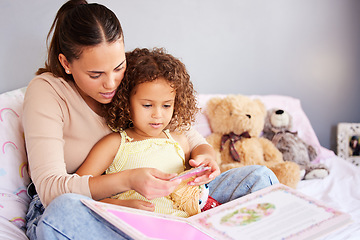 Image showing Reading, book and storytelling with mother with daughter in bedroom for fairytale, fantasy or creative. Education, learning and love with woman and girl in family home for study, literature and relax