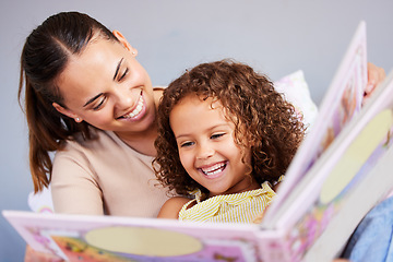 Image showing Learning, book and mother with daughter in bedroom for storytelling, fantasy or creative. Education, study and love with woman reading to young girl in family home for fairytale, literature and relax