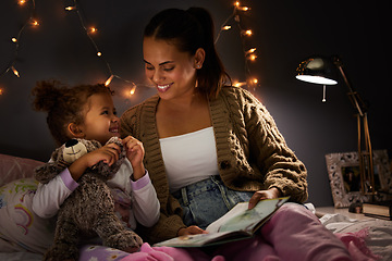 Image showing Night, book and learning with mother with daughter in bedroom for storytelling, fantasy and smile. Education, fairytale and love with woman reading to girl in family home for bedtime, happy or relax