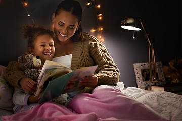 Image showing Night, book and mother with daughter in bedroom for storytelling, fantasy and creative. Education, learning and love with woman reading to young girl in family home for bedtime, literature and relax