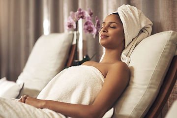 Image showing Spa, woman and relax on chair for calm, zen and peace for physical therapy, health and wellness. Female customer with eyes closed, luxury and towel for a holistic massage and hospitality at a salon