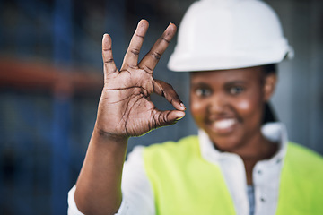 Image showing Black woman, architect and hands with okay sign for construction success, good job or precise on site. Hand of happy African female person engineer showing OK emoji, yes or perfect in architecture