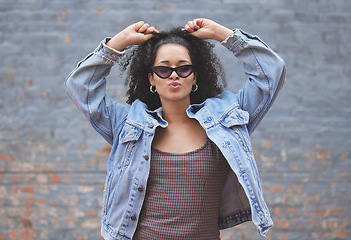 Image showing Fashion, attitude and portrait of woman on wall background in trendy, stylish and urban clothes. Beauty, freedom and happy female person pose in city with sunglasses, confidence and style outdoors