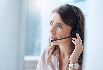 Image showing Worry, call center and woman with telemarketing, customer service and stressed in a workplace. Female person, employee or agent with headphones, tech support and help desk with advice or mistake