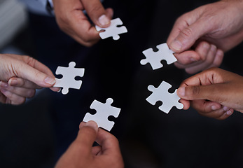 Image showing Puzzle, teamwork and support with hands of business people for synergy, partnership or trust. Integration, problem solving and solution with employees and jigsaw for mission, collaboration or process