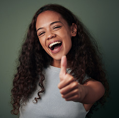 Image showing Happy woman, thumbs up and hand gesture, emoji and agreement with feedback isolated on green background. Yes, like and thank you, excited female person smile, OK sign and support closeup in studio