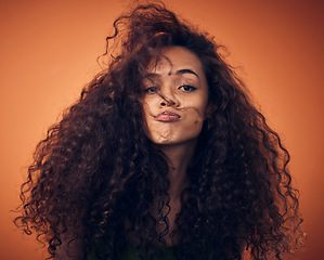 Image showing Portrait, beauty and woman with hair care, curly and volume against a studio background. Face, female person and model with salon treatment, wavy and grooming with cosmetics for hairstyle and growth