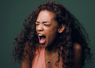 Image showing Stress, anxiety and angry woman scream in studio for fear, mistake or psychology crisis on green background. Depression, trauma and anger by female frustrated with mental health problem, fail or ptsd