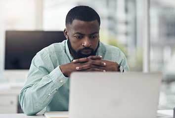 Image showing Thinking, focus and man on laptop in office for solution, research and serious job decision or planning. Reading, review and choice of african person or business analyst on computer problem solving