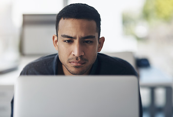 Image showing Laptop, focus and business man reading online for information technology, software development or web coding. Code, programming and serious IT person on computer for system review, analysis or check