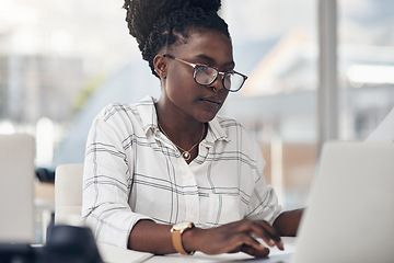 Image showing Laptop, typing and business woman for online research, editing or copywriting at her office desk with email. Planning, working and african person, editor or employee on computer for blog or article