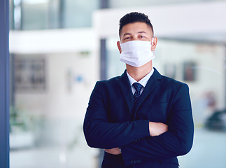 Image showing Business man, face mask and portrait with arms crossed for company work, attorney and motivation. Success, male employee and professional lawyer in law firm at office with job pride and virus safety