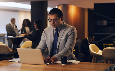 Image showing Laptop, corporate lobby and business man review economy report, online analysis or typing web feedback. Night reading, coworking and finance person doing research, computer search and financial work