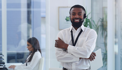 Image showing Call center, portrait or black man with arms crossed in customer service, support or telemarketing office. Employee, businessman or crm consultant with tablet, technology or contact us for advice