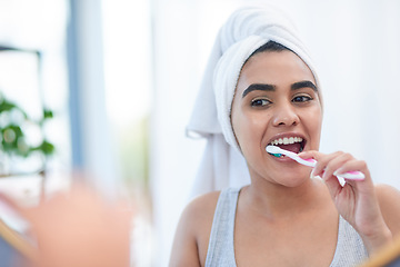 Image showing Toothpaste, woman and toothbrush for cleaning teeth, dental health or morning shower in bathroom. Girl, face in mirror and washing mouth with tooth brush, hygiene and smile for health and wellness