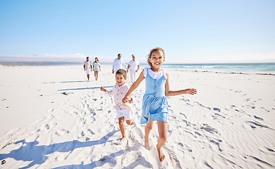 Image showing Big family, sea or happy kids holding hands, running or smiling in summer with happiness or joy in nature. Grandparents, smile or young children siblings bonding, playing or walking on beach sand