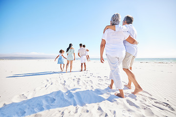 Image showing Big family, sea or old couple walking with kids in summer with happiness, trust or peace in nature. Grandparents, back view or senior man bonding with woman or children taking a walk on beach sand