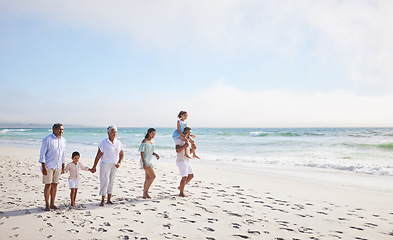 Image showing Big family, grandparents walking or children on beach with young siblings holding hands on holiday together. Dad, mom or kids love bonding, smiling or relaxing with senior grandmother or grandfather