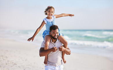 Image showing Piggyback, sea or father walking with a child for a holiday vacation together with happiness in summer. Smile, fly or dad playing or enjoying family time with a happy girl or young kid on beach sand