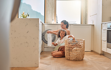 Image showing Cleaning, teamwork and washing machine with mother and daughter for helping, learning and cleaner. Housekeeping, laundry and basket with woman and young girl in family home for teaching and clothes