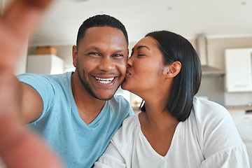 Image showing Young couple, kitchen and selfie with kiss, happiness or love with smile in post, social media app and home together. Man, woman and happy with photography, profile picture and internet blog in house