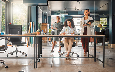 Image showing Business women, fashion designer team and office with planning at a design company. Creative management, working and female staff in a conversation and meeting for teamwork and strategy in workplace