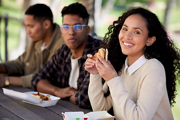 Image showing Students, smile and friends eating a burger together in university or college campus for a break meal. Happy, portrait and woman with group of young people with food, lunch or relax in a restaurant