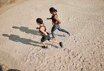 Image showing Fitness friends running on the beach, women workout together with cardio and active body on sand outdoor. Exercise in nature, healthy and top view of female people training with run and mockup space