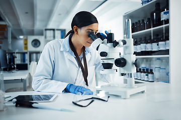 Image showing Woman, scientist and microscope analysis to check DNA sample with science experiment in laboratory. Female doctor analyze data, scientific innovation and medical research in lab with investigation