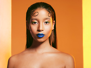 Image showing Makeup, blue lipstick and portrait of woman in studio for cosmetics, eye shadow and beauty with color. Creative, cosmetics and face of female person on yellow background for glamour, fashion or style