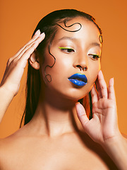 Image showing Neon makeup, beauty and portrait of woman in studio for cosmetics, eye shadow and aesthetic. Creative design, cosmetology and face of female person with blue lipstick for glamour, fashion and style