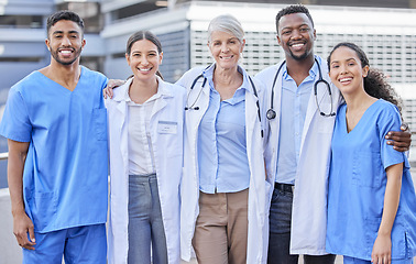 Image showing Doctor team, city and hug with diversity and happy nurse from healthcare and wellness work. Urban, nursing and clinic group with doctors and support with success, motivation and smile outdoor